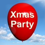 Xmas Party Balloon Shows Christmas Festivity And Celebration Stock Photo