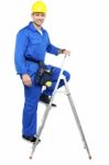 Worker Climbing On Stepladder Stock Photo