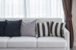 Row Of Pillows On Modern Sofa In Living Room Stock Photo