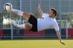 Shoot Of Football Player On The Outdoors Field Stock Photo