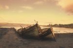 Abandoned Boats On The Beach Stock Photo