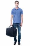 Smiling Casual Man Standing With Bag Stock Photo