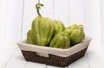 Chayote Fruit On White Wood Background Stock Photo