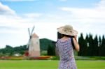 Woman Shooting Photo In Garden Stock Photo