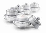 Several Silver Deluxe Cosmetic Jar On White Background Stock Photo