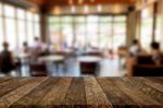 Selected Focus Empty Brown Wooden Table And Coffee Shop Or Resta Stock Photo