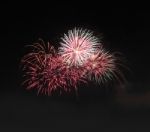 Group Firework Style Explode Line On Night Sky Stock Photo