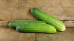 Fresh Cucumber On The Wooden Background Stock Photo