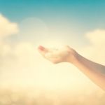 Hands Of Little Girl On Natural Background Stock Photo