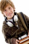 Schoolboy With Headset And Books Stock Photo