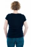 Rear View Of Curly Haired Woman Stock Photo