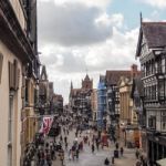 People Shopping In Chester City Centre Stock Photo