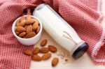 Almond Milk On Wood Table Stock Photo