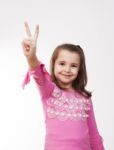 Girl Showing Victory Sign Stock Photo