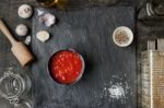 Pureed Tomatoes In A Ceramic Dish On A Table Stock Photo