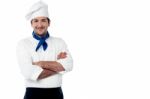 Confident Young Cook Posing In Uniform Stock Photo