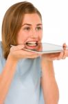 Teenage Girl Biting Tablet Pc Stock Photo