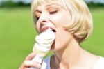 Middle Aged Woman Eating An Ice Cream Stock Photo