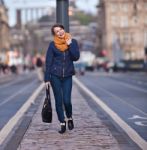 Pretty Girl Walking On The Road Stock Photo