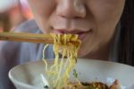 Woman Eating Noodles Stock Photo