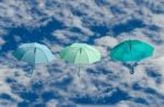 Multicolored Umbrellas Against  Blue Sky Background Stock Photo