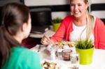 Happy Young Girls Enjoying Their Dinner Stock Photo