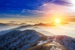 Winter Landscape With Sunset And Foggy In Deogyusan Mountains, South Korea Stock Photo