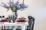 White Dinning Table With Black Chair In Dinning Room Stock Photo