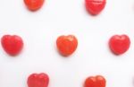 Red Valentine's Day Heart Shape Candy Pattern On Empty White Paper Background. Love Concept. Colorful Hipster Style. Knolling Top View Stock Photo