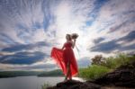 Beautiful Woman Wear Red Evening Dress Hold A Bouquet Of Flowers Stock Photo