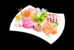 Mixed Sashimi In White Plate Isolated On Black Background,with C Stock Photo