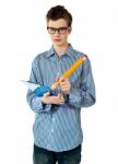 Boy Writing On Clipboard Stock Photo