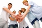 Teenagers With Hands Together Stock Photo