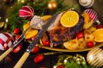 Christmas Baked Duck Served With Potatoes, Orange And Tomatoes Stock Photo