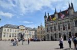 Bruges, Belgium - May 11, 2015: Tourists On Burg Square In Bruge Stock Photo