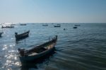 Beautiful View Of Fishing Boats Sailing In The Sea In Dusk Sunset Twilight Time Stock Photo