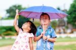 Boy And Little Girl In The Park Stock Photo