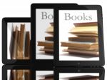 Tablet Computer With Books Stock Photo