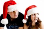 Young Couple Wearing Christmas Hat Stock Photo