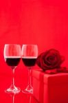 St Valentine's Setting With Present And Red Wine Stock Photo