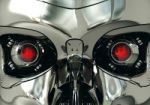 Red Robotic Eyeballs And Robot Skull In Metallic Surface, Cybernetic Technology Stock Photo