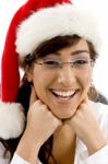 Smiling Lady Wearing Christmas Hat Stock Photo