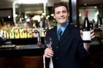 Man Posing With A Bottle Of Wine Stock Photo