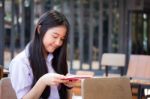 Asia Thai High School Student Uniform Beautiful Girl Read A Book Stock Photo