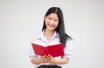 Asia Thai High School Student Uniform Beautiful Girl Read A Book Stock Photo