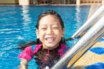 Girl Side Of Swimming Pool Stock Photo