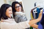 Two Beautiful Girls Shopping In A Clothes Shop Stock Photo