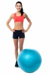 Young Woman In Gym Wear With Exercise Ball Stock Photo