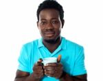 African Guy Holding Coffee Mug Stock Photo