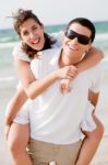 Young Man Piggyback His Girlfriend Stock Photo